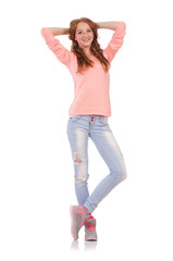 Cute smiling girl in pink blouse and jeans isolated on white