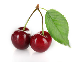 Fresh cherries with leaf isolated on white