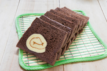 sliced chocolate bread with jam roll cakes