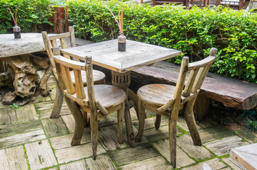 outdoor setting- a table and chair in a garden