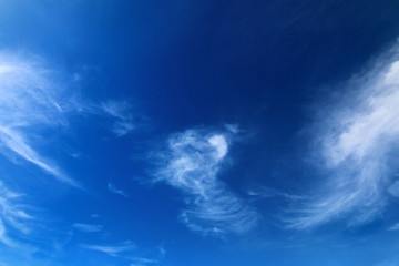 blue sky background with tiny clouds