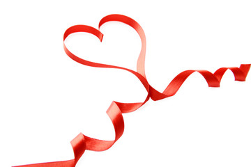 Red ribbon in shape of heart isolated on white