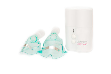 Сompact ultrasonic nebulizer with two masks.Isolated on white.