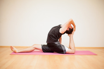 Young man during yoga practice