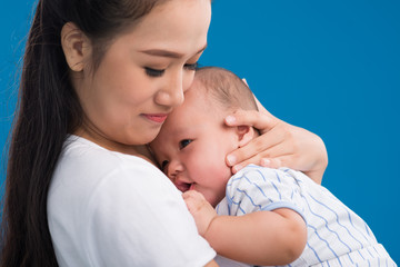 Hugging newborn baby