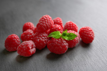 Fresh red raspberries on wooden background