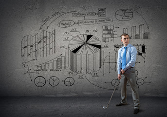 Businessman playing golf