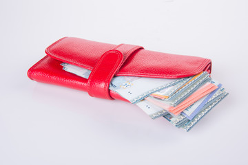 wallet. woman wallet with money on a background