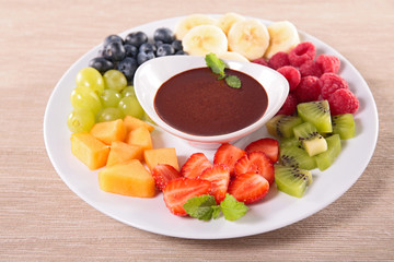 fruits and chocolate sauce