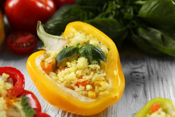 Stuffed peppers with vegetables on table close up