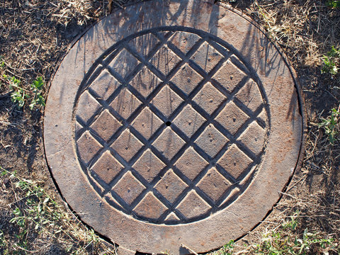 Old and rusty manhole