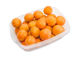Ripe apricot in plastic tray closeup