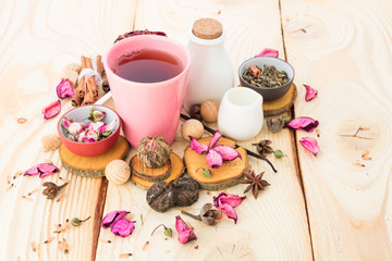 Tea cups with teapot on old wooden table
