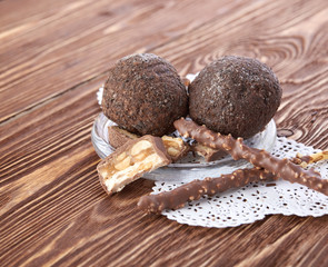 Cupcake with chocolate on wooden background