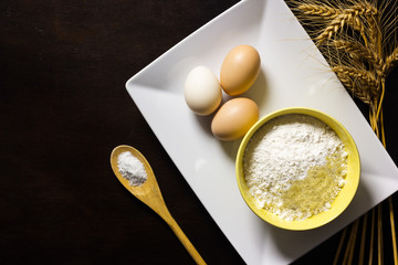 Baking ingredients on wood table background