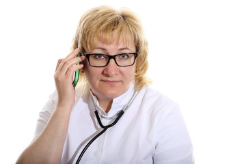 doctor with stethoscope speaks on the phone