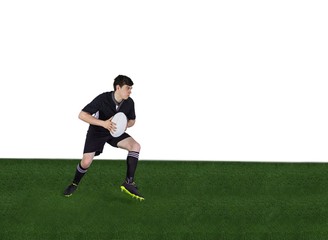 Rugby player running with the rugby ball