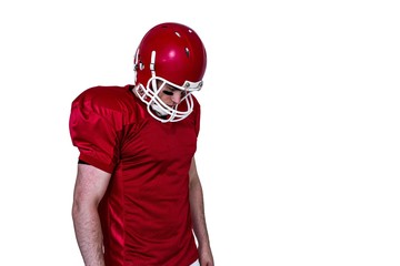 Unsmiling american football player looking down