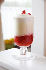 White chocolate mousse with strawberry sauce