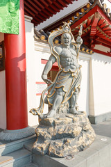 The God statue at the front door, Buddha Tooth Relic Temple in Chinatown, Singapore.