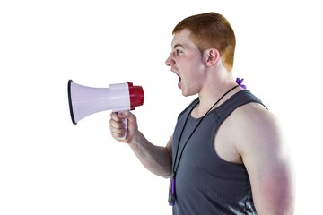 Angry personal trainer yelling through megaphone 