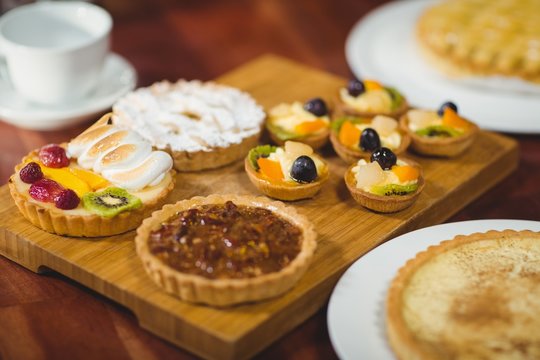 Close up wooden tray of tasty pastries