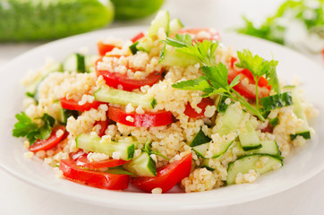 Healthy salad on a white plate.
