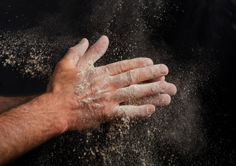 Naklejka na ściany i meble Hand with a flour