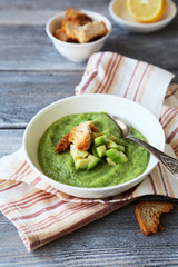 cold avocado cream-soup in white bowl