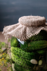 Jar of pickles on wooden table