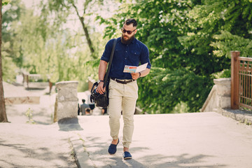 bearded man travels with map