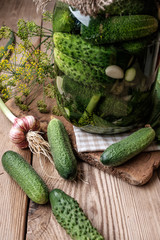 Jar of pickles on wooden table