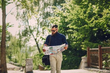 bearded man travels with map