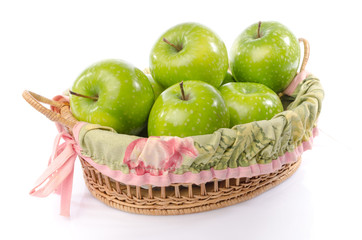 Fresh green apples in a basket