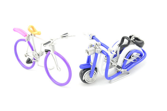 images the beauty of handcraft bicycle and scooter made from wired placed opposite each other isolated white background