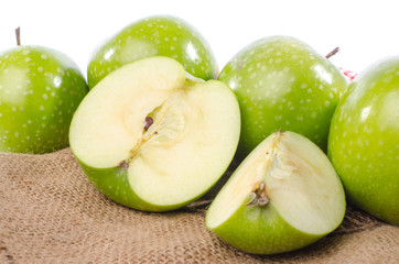 Fresh green apples on burlap
