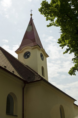 Fototapeta premium church bell tower with a clock