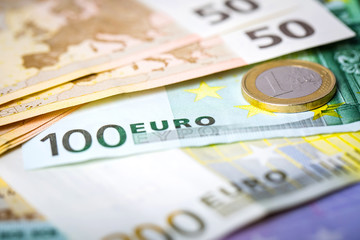 Closeup of euro banknotes and coins