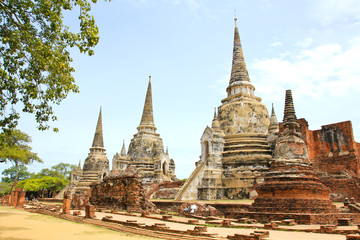 Fototapeta na wymiar Ancient Buddhist pagoda ruins at Wat Phra Sri Sanphet temple.