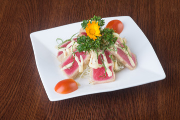 japanese cuisine. tuna sushi on the background