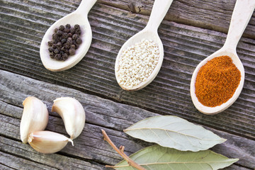 Various spices on wooden background