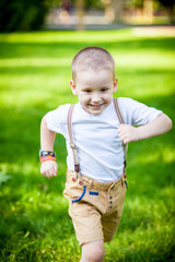 Boy running on grass