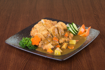 japanese cuisine. fried chicken curry on the background