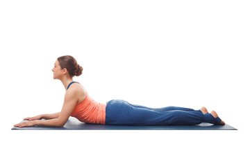 Sporty fit yogini woman practices yoga asana salamba bhujangasan