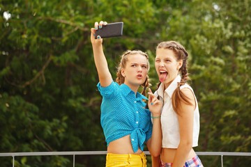 Obraz premium Best girlfriends photographed in park.