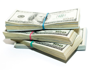 Bundles of US dollars banknotes on a white background