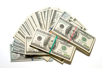 Bundles of US dollars and  banknotes on a white background