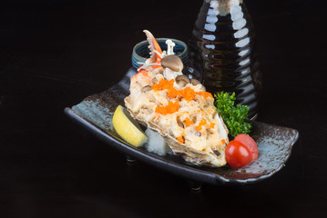 japanese cuisine. grilled shell fish on the background