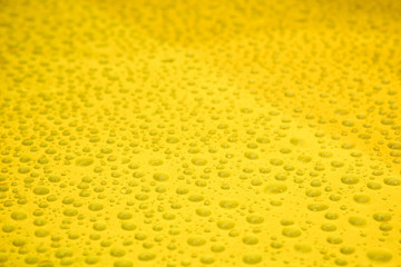 Raindrops on yellow background