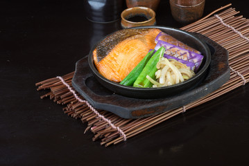 japanese cuisine. hot plate fish on the background